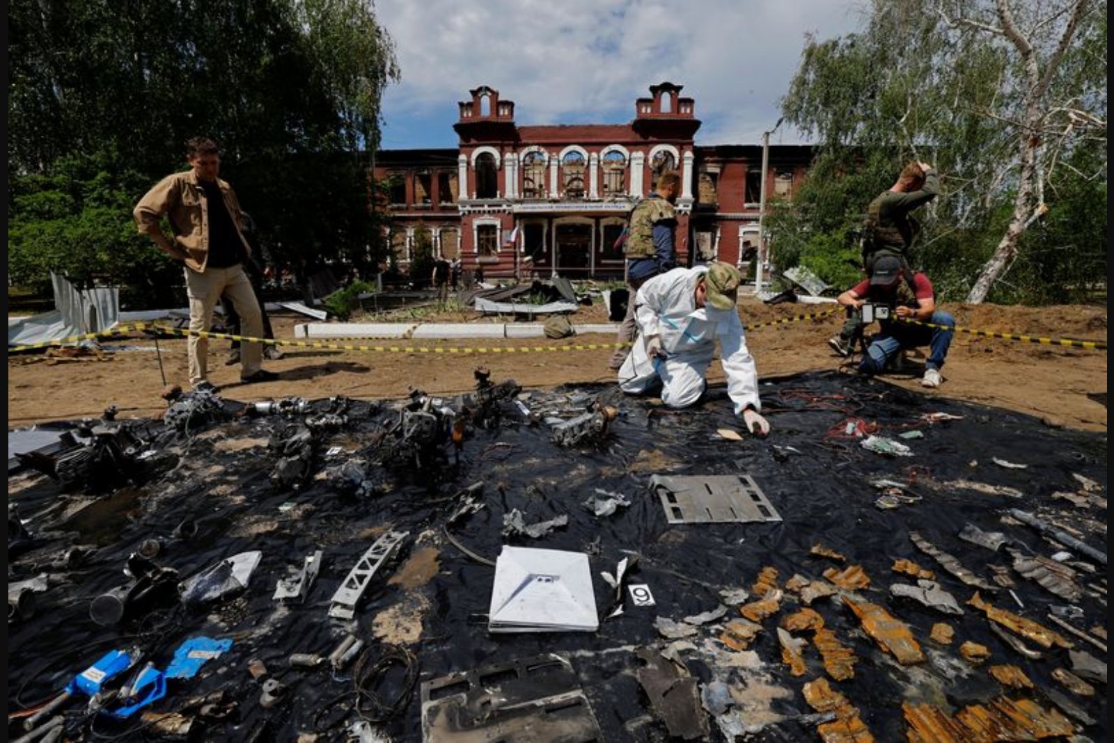 Forensic teams examine devastated teacher training dormitory in Luhansk amid mutual blame