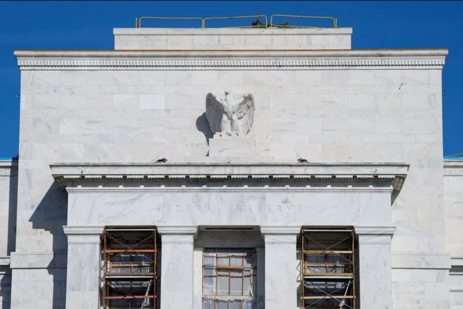 Economists Predict Fed Will Pause Rate Moves for Remainder of Year Despite Market Betting on Hikes